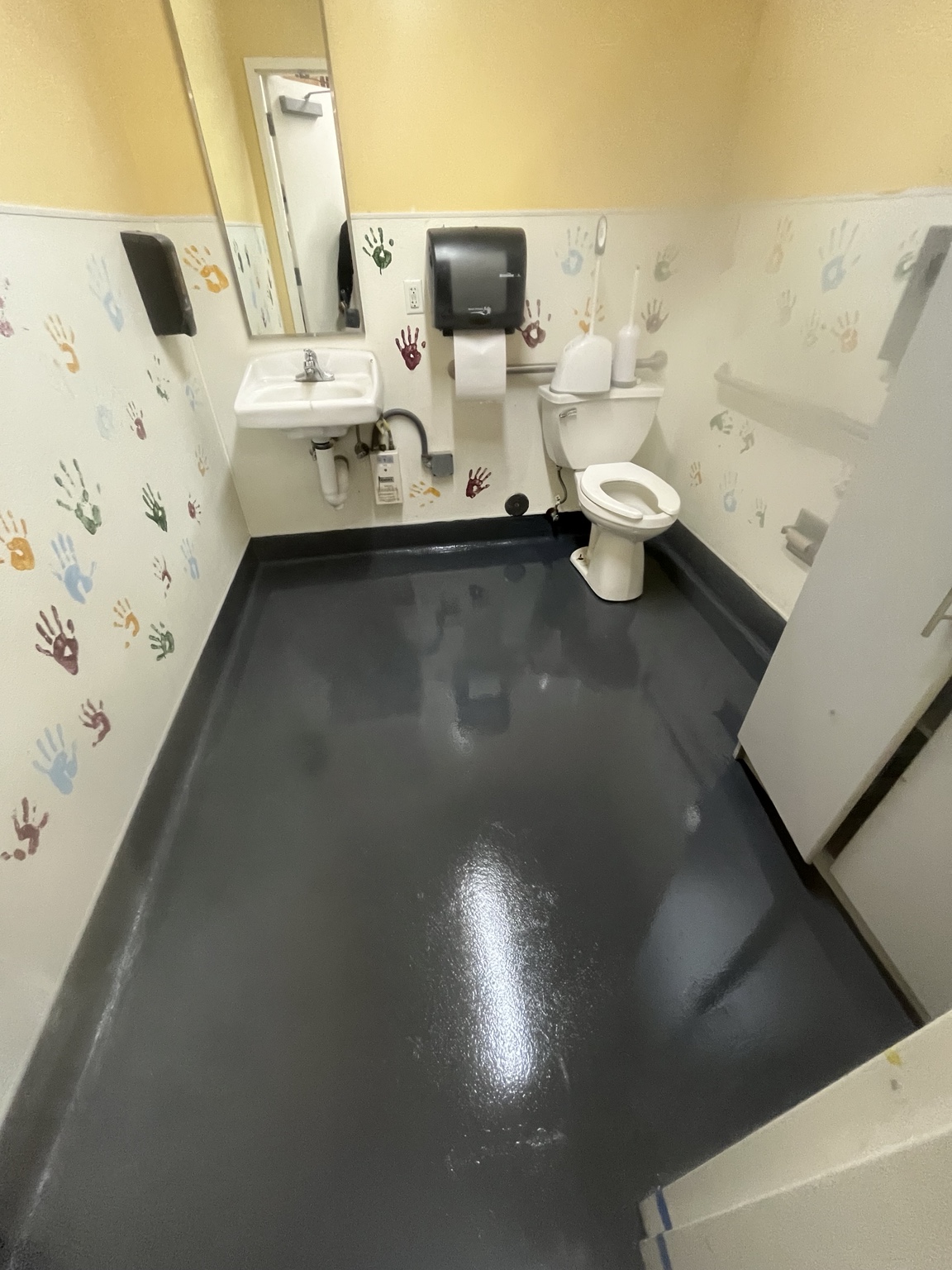 Seamless restroom floor and cove